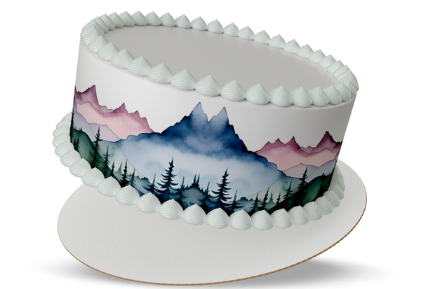 Decorative cake with mountain and forest design on a white background