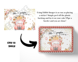 Edible cake topper with pumpkin design and text 'A sweet little pumpkin is on the way' on a white background.