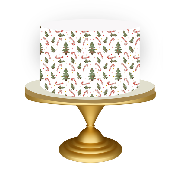 Cake with Christmas-themed design on a gold stand against a white background