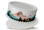 Cake with mountain and forest design on a white background