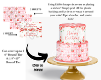 Edible cake topper with strawberry pattern and 'Happy Birthday' text, shown on a cake stand.