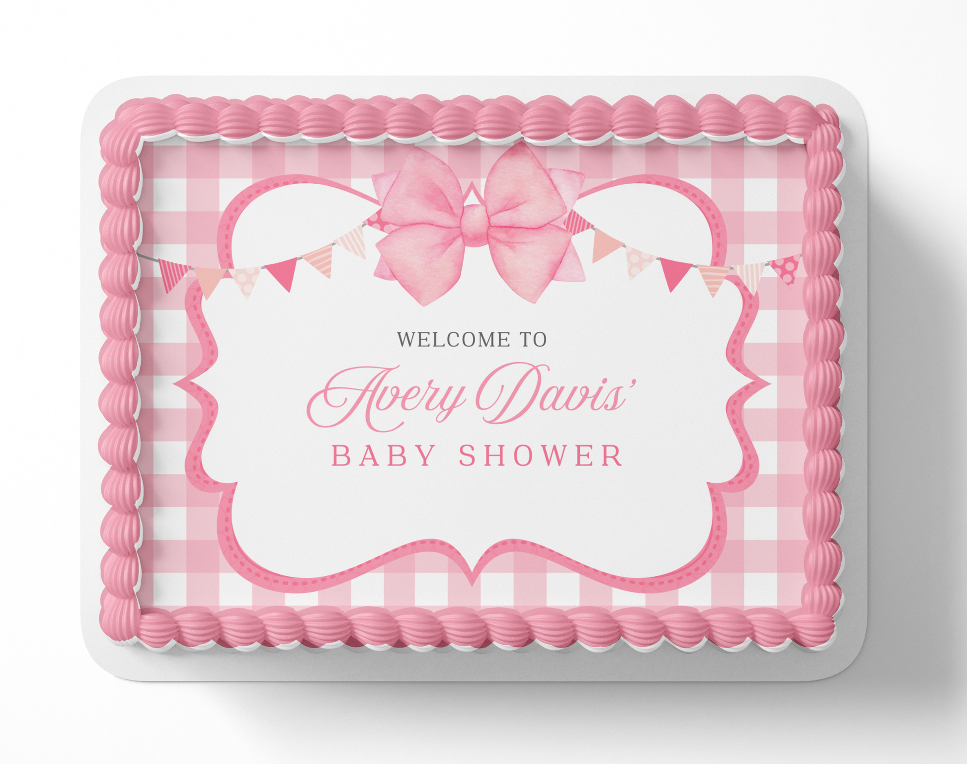 Pink baby shower cake with decorative elements and text on a white background